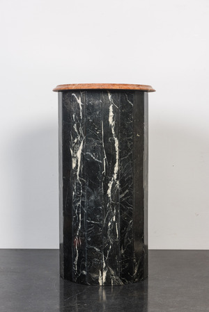 A black marble stand with orange-red marble top, 20th C.