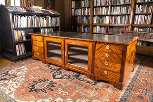 An English neoclassical leather-topped mahogany library desk with gilt bronze mounts, 19th C.
