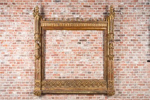 An impressive Gothic Revival carved and gilt wood frame with monks under canopies, 19th C.