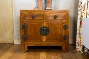 A Chinese two-door cabinet with two drawers, 20th C.