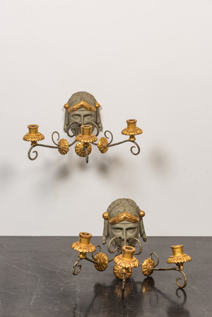 A pair of partly gilt and painted wooden wall appliques, 19th C.