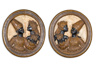 A pair of Italian oval wooden medallions with a Moorish couple, probably Venice, 19th C.