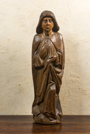 A large walnut figure of John the Baptist from a calvary, late 15th C.