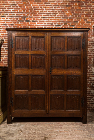 A Flemish Gothic oak two-door cabinet with linenfold panels, 19th C. with older elements