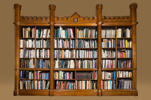 An oak open library bookcase with a castle-shaped crown, 19th C.