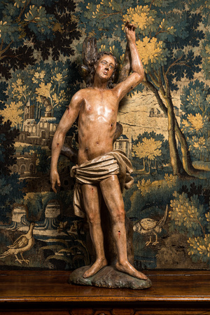 A large German polychrome wooden sculpture of Saint Sebastian, 16h C.