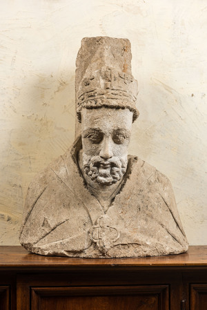 A French limestone bust of a bishop, 14/15th C.