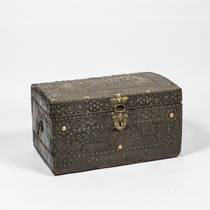 A leather upholstered brass-mounted wooden coffer, 17th C.