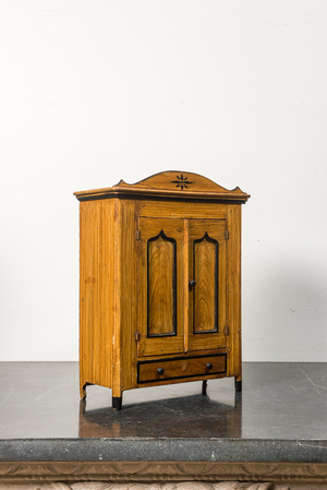 A miniature pine wood two-door cupboard, 19th C.