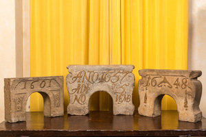 Three dated stone arch-shaped architectural elements, 17th C.