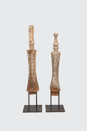 A pair of Indian wooden ornaments on a metal base, 19th C.