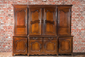 A large French oak two-part cupboard with eight doors and two drawers, Lorraine region, 18th C.
