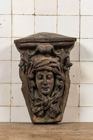 A patinated concrete wall console with mascaron, 20th C.