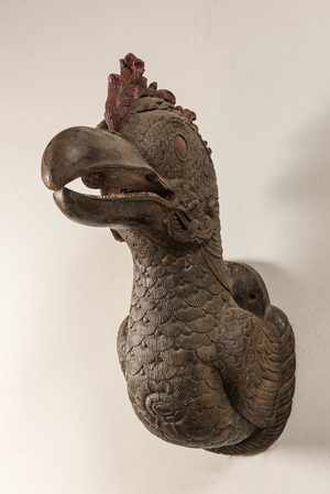 A polychrome wooden sculpture of a dodo's head, 20th C.