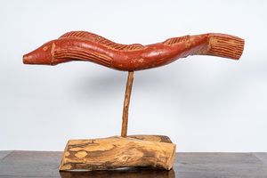 A polychromed wooden eel on foot, 20th C.