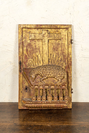 A gilt wooden tabernacle door depicting The Lamb of the Apocalypse, 17/18th C.