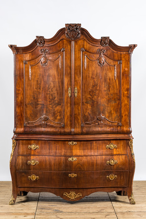 A Dutch mahogany veneered cabinet with two doors and three drawers, 18th C.