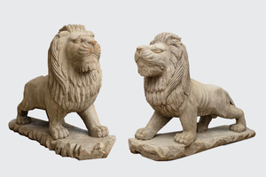 A pair of large patinated wooden lions, 19th C.