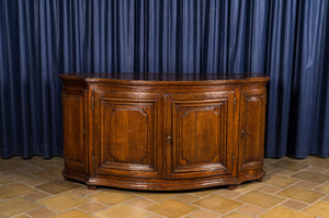 A French oak sideboard with curved front, 18th C.