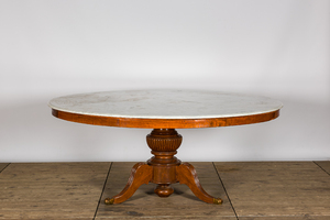 A large round French tripod Louis Philippe table with a white marble top, 19th C.