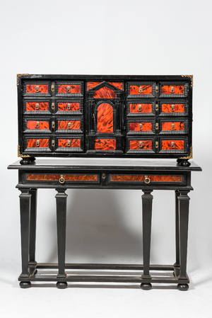 An ebonised wooden cabinet with faux-tortoiseshell veneer, 19th C.