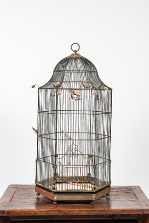 A metal birdcage adorned with porcelain flowers, 19th C.
