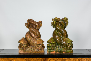 A pair of large Italian glazed terracotta sculptures of entwined dolphins, 20th C.