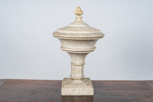 A white marble urn with floral top, 20th C.