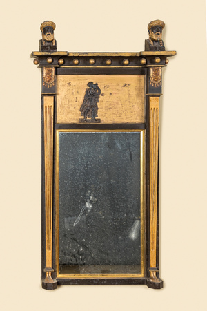 A partly gilt wooden Empire mirror, 19th C.