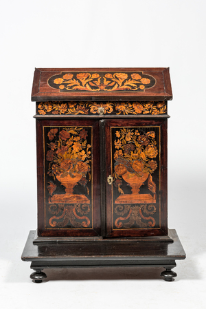 A mahogany floral marquetry secretaire on foot, 19th C. and earlier