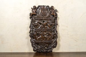 A Flemish reticulated oak panel with a carpenters' guild coat of arms, late 16th C.