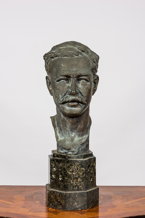 A bronze male bust on a marble base, 20th C.