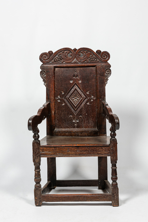 An English walnut and oak wooden armchair, 18th C.