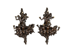 A pair of French patinated bronze seven-light wall lights, 20th C.