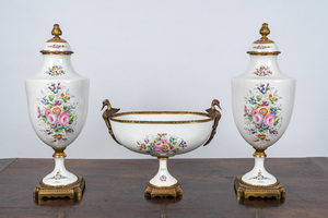 A French Limoges porcelain three-piece garniture with floral and gilt design, 20th C.