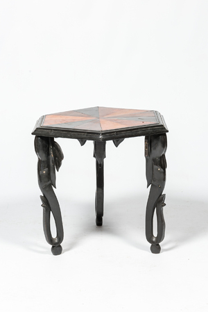 An hexagonal African colonial parquetry side table on elephant legs, 20th C.