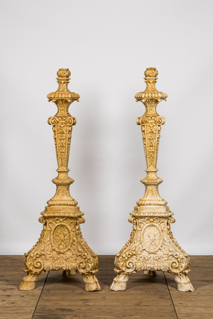 A pair of imposing patinated and gilt church candlesticks, 20th C.