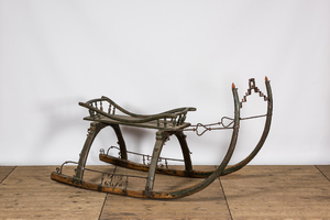 A wrought iron-mounted green-painted wooden sleigh, 19th C.