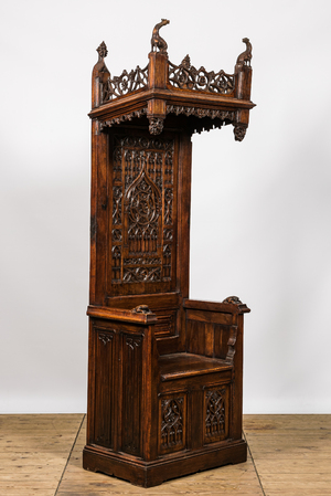 A large Gothic Revival oak hooded throne chair with dragons and frogs, 19th C.