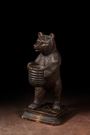 A 'Black Forest' wooden bear holding a beehive, Switzerland, 19th C.