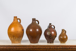 Four various stoneware jugs, incl. two bellarmine jugs and one with a gilt bronze chain mount, Raeren and Frechen, 17th C.