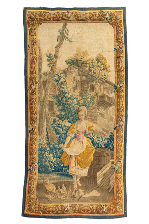 A French Aubusson wall tapestry depicting a young peasant woman feeding poultry, 18th C.