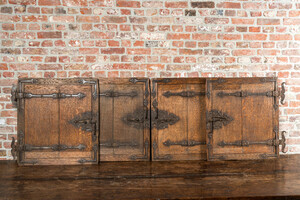 Four wrought iron-mounted oak doors, 18/19th C.