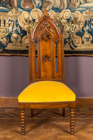 An English Victorian Gothic Revival oak high back arm chair, 19th C.
