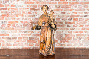 A polychrome wooden Saint Anthony holding the Child Jesus, 17th C.