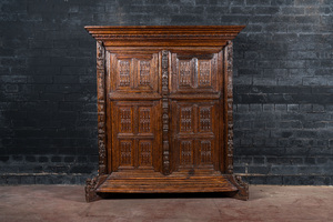 A rare German carved oak sculptural cupboard on diagonal supports with recumbent lions, Westphalia, 16th C.