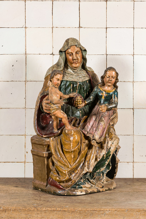 A polychromed wooden Saint Anne Trinity with pomegranate group, 17th C.