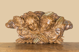 A wooden relief depicting two angels with traces of polychrome and gilt, 18th C.