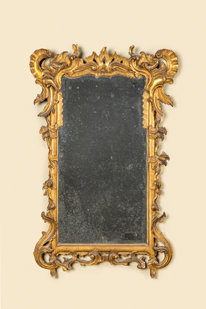 A French finely carved gilt wooden Régence mirror, 18th C.