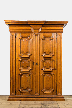 A wooden two-door cabinet, ca. 1700